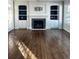 Living room with fireplace and dark hardwood floors at 6297 W Prentice Ave, Littleton, CO 80123