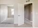 Bright bedroom with mirrored closet doors and a connecting room, providing flexibility and space at 3415 Florence Way, Denver, CO 80238