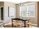 Dining room with hardwood floors and an elegant black table at 3415 Florence Way, Denver, CO 80238