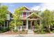 Charming two-story home with a well-maintained front yard and inviting front porch at 3415 Florence Way, Denver, CO 80238