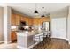 Kitchen with a large island, stainless steel appliances, and wood cabinets at 3415 Florence Way, Denver, CO 80238