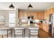 Kitchen features granite countertops, stainless steel appliances, and a spacious island at 3415 Florence Way, Denver, CO 80238