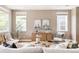 Bright living room with hardwood floors, neutral decor and lots of natural light at 3415 Florence Way, Denver, CO 80238