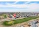Aerial view of home's location, nestled in a neighborhood adjacent to the golf course with open views at 11033 Olathe St, Commerce City, CO 80022