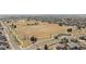 Wide aerial view of the community, showing large open spaces, walking trails, and residential areas at 11033 Olathe St, Commerce City, CO 80022