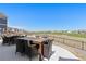 Outdoor patio area overlooking a well-maintained green space, perfect for entertaining and relaxing at 11033 Olathe St, Commerce City, CO 80022