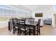 Dining room features a large table, big windows, and an open floor plan at 11033 Olathe St, Commerce City, CO 80022