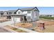 Beautiful two-story home featuring a stone and siding exterior, landscaping, and an attached garage at 11033 Olathe St, Commerce City, CO 80022