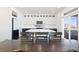 Modern kitchen with white upper cabinets, navy blue lower cabinets, and large island at 11033 Olathe St, Commerce City, CO 80022