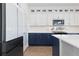 Modern kitchen features white countertops, navy cabinets, and stainless steel appliances at 11033 Olathe St, Commerce City, CO 80022