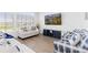 Comfortable living room features modern furniture, hardwood floors, and a large window at 11033 Olathe St, Commerce City, CO 80022