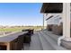 Spacious patio featuring outdoor dining and seating area with serene golf course views at 11033 Olathe St, Commerce City, CO 80022