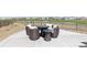 Relaxing patio seating area with comfortable wicker chairs and a fire pit table overlooking the neighborhood at 11033 Olathe St, Commerce City, CO 80022