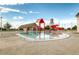 Community pool area featuring a splash pad and water slides for Gathering fun in a relaxing environment at 11033 Olathe St, Commerce City, CO 80022