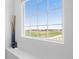 Bright window with view of well-maintained green and neighborhood homes under a clear sky at 11033 Olathe St, Commerce City, CO 80022
