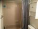 Bathroom with a tiled shower, bathtub combination, and practical storage cabinet at 1511 Belero St, Broomfield, CO 80020