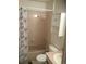 Cozy bathroom featuring a shower-tub combo, floral shower curtain, and a built-in cabinet at 1511 Belero St, Broomfield, CO 80020