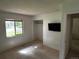 Sunlit bedroom with a large window offering neighborhood views at 1511 Belero St, Broomfield, CO 80020