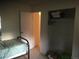 Simple bedroom featuring an open closet storage area and view of hallway at 1511 Belero St, Broomfield, CO 80020