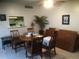 Cozy dining area with a table set for gathering and a pass-through to the kitchen at 1511 Belero St, Broomfield, CO 80020