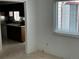 Dining room area with a window with blinds and kitchen view at 1511 Belero St, Broomfield, CO 80020