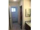Hallway leading to bathroom, with sink and closet in view at 1511 Belero St, Broomfield, CO 80020