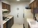 Functional kitchen with appliances and laminate countertops for simple meal preparation at 1511 Belero St, Broomfield, CO 80020