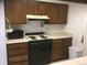 Efficient kitchen featuring classic cabinets, a range, and plenty of countertop space at 1511 Belero St, Broomfield, CO 80020