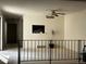 Living room with a ceiling fan and a serving hatch looking through to the kitchen at 1511 Belero St, Broomfield, CO 80020