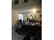 Cozy living room featuring an open kitchen and staircase at 1511 Belero St, Broomfield, CO 80020