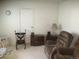 Relaxing living room featuring a comfortable recliner and ample space for seating at 1511 Belero St, Broomfield, CO 80020