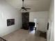 Living room with a brick fireplace, ceiling fan, and ample natural light, creating a cozy atmosphere at 1511 Belero St, Broomfield, CO 80020