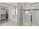 Primary bathroom with soaking tub, walk-in shower, and access to walk-in closet at 1866 Sawtooth Mountain Dr, Berthoud, CO 80513