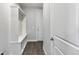 This mud room offers a bench with storage and coat hooks near an exterior door at 1866 Sawtooth Mountain Dr, Berthoud, CO 80513
