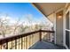 Balcony with black railing and a treelined view at 8678 Decatur St # 283, Westminster, CO 80031