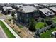 Expansive aerial view of a home displaying a large backyard, lush lawn, and a charming white picket fence at 90 Pipit Lake Way, Erie, CO 80516