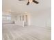 Spacious bonus room with neutral carpet and white walls, featuring a large window and cubbies at 90 Pipit Lake Way, Erie, CO 80516