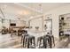 Open-concept kitchen with a large island and seating, seamlessly connected to the living area at 90 Pipit Lake Way, Erie, CO 80516