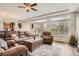 Cozy living room filled with natural light and comfortable seating at 90 Pipit Lake Way, Erie, CO 80516