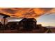 Beautiful street view of a home with a dramatic sky and mountain views at 90 Pipit Lake Way, Erie, CO 80516