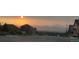 Street view of homes with scenic mountain views at sunset at 90 Pipit Lake Way, Erie, CO 80516