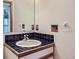 Charming bathroom features tiled countertop and backsplash with vintage fixtures at 135 Poorman Rd Rd, Boulder, CO 80302