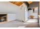 Attic bonus room with unique wood beam ceilings, carpeted floors, and access to a deck at 135 Poorman Rd Rd, Boulder, CO 80302