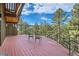 Outdoor deck overlooking trees, offering a serene and peaceful retreat at 135 Poorman Rd Rd, Boulder, CO 80302
