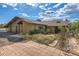 Charming home with a paved walkway and mature landscaping at 135 Poorman Rd Rd, Boulder, CO 80302