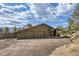 Spacious three-car garage with ample parking and scenic views of the mountains and big blue skies at 135 Poorman Rd Rd, Boulder, CO 80302