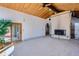 Spacious living room featuring a fireplace, access to an outdoor space, and neutral décor at 135 Poorman Rd Rd, Boulder, CO 80302