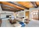 Comfortable living room with a brick fireplace, neutral color palette, and modern furnishings at 135 Poorman Rd Rd, Boulder, CO 80302