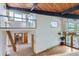 Open concept living area with wood floors, exposed beams, and natural light at 135 Poorman Rd Rd, Boulder, CO 80302