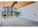Bright living room with wood ceiling and expansive window views at 135 Poorman Rd Rd, Boulder, CO 80302